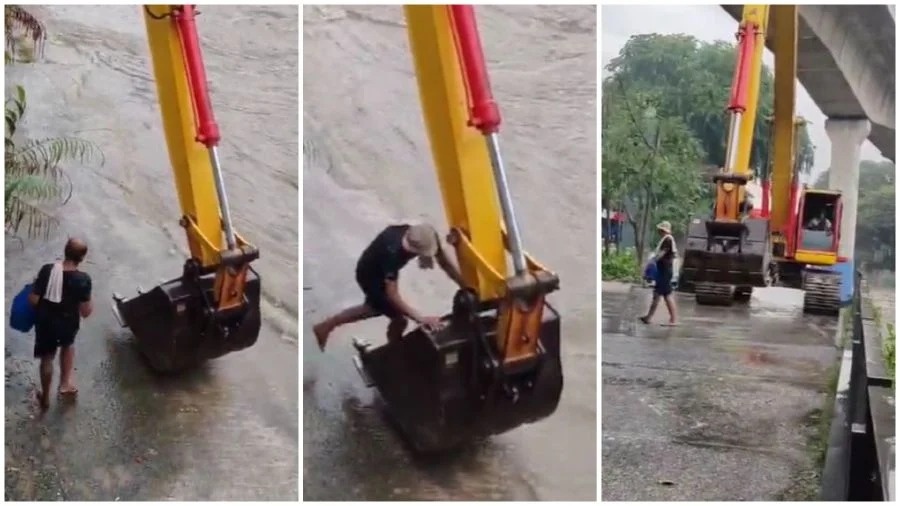 ஆற்றங்கரையில் சிக்கிய ஆடவரைக் காப்பாற்றும் ஜேசிபி இயந்திர வாகனம்