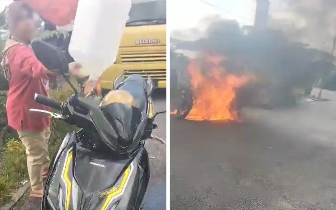 மோட்டார் சைக்கிளுக்கு தீயிட்ட மாது கைது